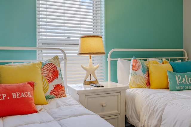 bedroom featuring multiple windows