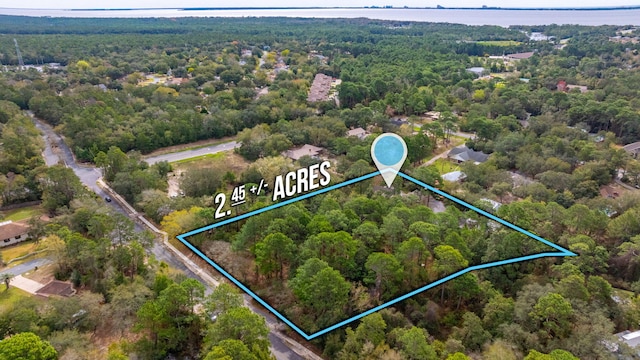 aerial view with a wooded view