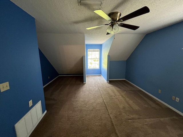 bonus room with lofted ceiling, baseboards, and visible vents