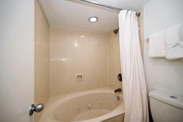 bathroom with shower / tub combo and toilet