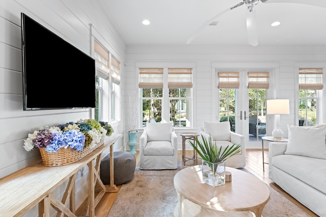 sunroom / solarium with french doors and ceiling fan