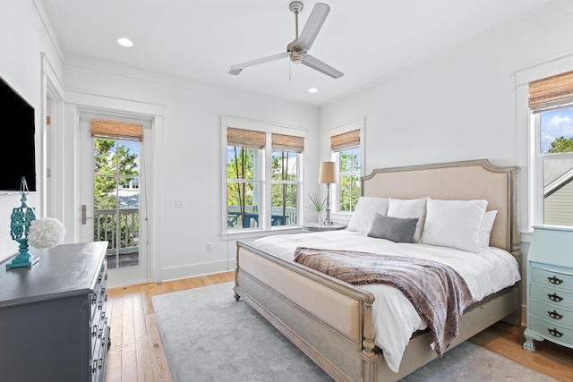 bedroom with ceiling fan, multiple windows, light hardwood / wood-style flooring, and access to outside