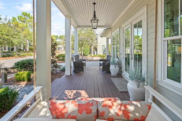 wooden deck featuring covered porch