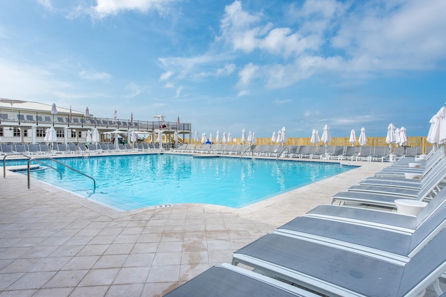 view of swimming pool featuring a patio area