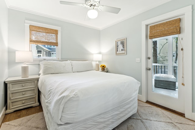 bedroom with ceiling fan, ornamental molding, light wood-type flooring, and access to exterior