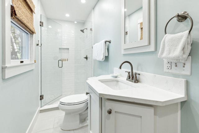 bathroom featuring vanity, tile patterned floors, toilet, and an enclosed shower