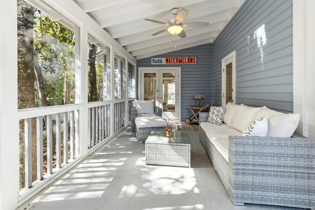 sunroom featuring ceiling fan and lofted ceiling with beams