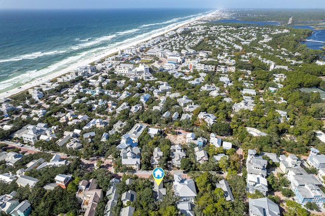 bird's eye view with a water view and a beach view