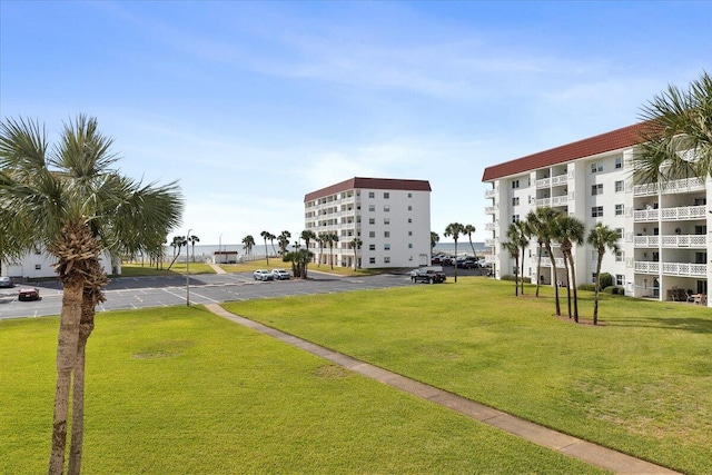 view of community featuring a lawn