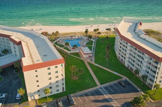 drone / aerial view featuring a view of the beach and a water view