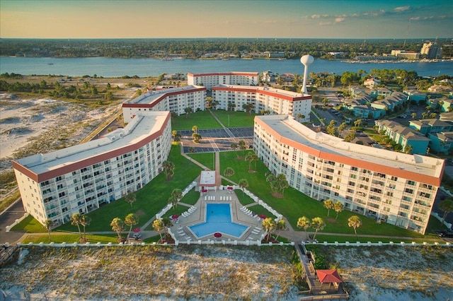 aerial view at dusk with a water view