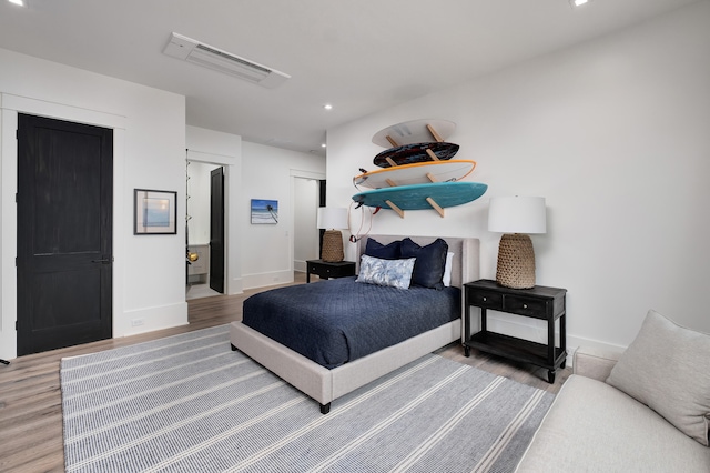 bedroom with hardwood / wood-style floors