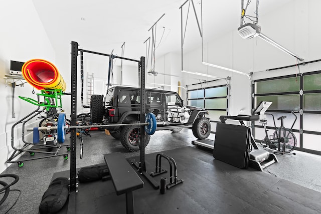 workout area featuring a high ceiling