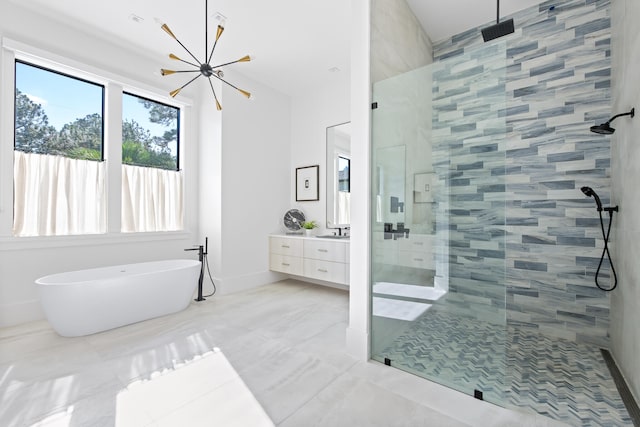 bathroom with vanity, shower with separate bathtub, and an inviting chandelier