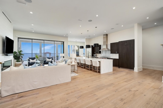 living room with light hardwood / wood-style floors