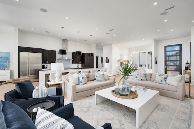 living room with a notable chandelier