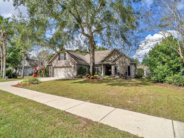 view of front of home featuring a front yard and a garage