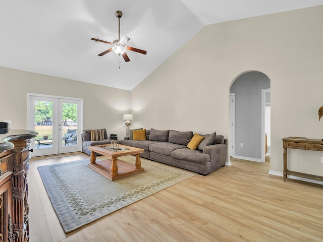 living room with french doors, light hardwood / wood-style floors, and ceiling fan