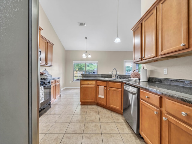 kitchen with sink, stainless steel appliances, a chandelier, pendant lighting, and light tile patterned flooring