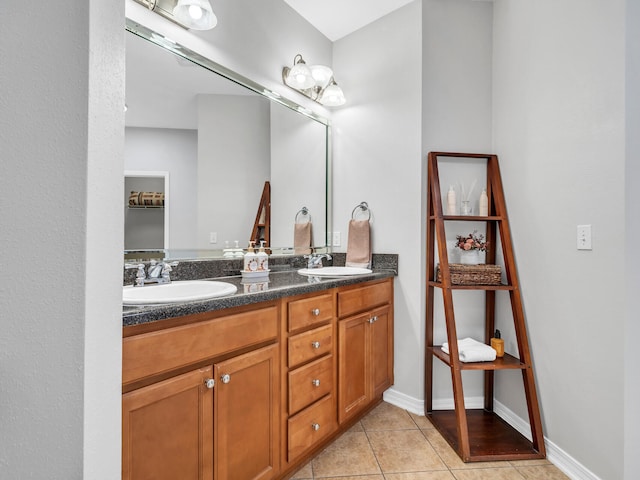 bathroom with tile patterned flooring and vanity