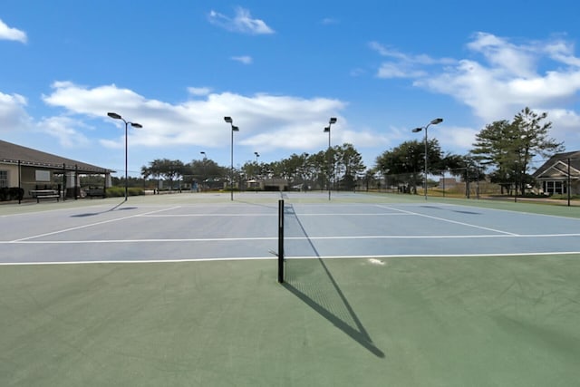 view of tennis court featuring basketball court