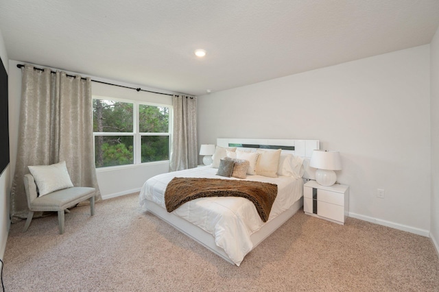 bedroom featuring light colored carpet