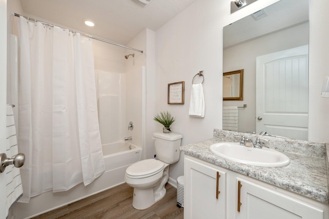 full bathroom featuring toilet, shower / tub combo, vanity, and wood-type flooring