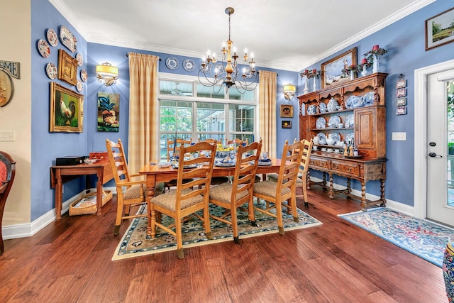 dining room featuring ornamental molding, a chandelier, and dark hardwood / wood-style floors