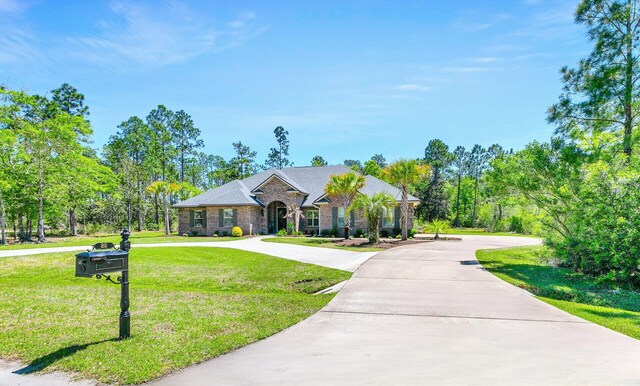 ranch-style house with a front yard