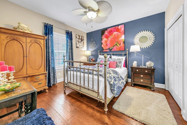 bedroom with a closet, ceiling fan, and hardwood / wood-style floors