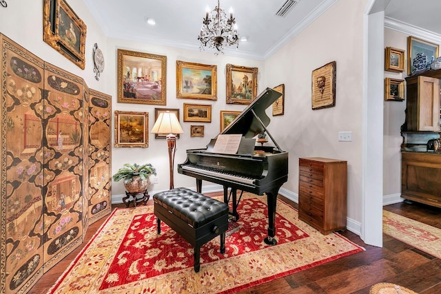 miscellaneous room featuring an inviting chandelier, crown molding, and dark hardwood / wood-style flooring