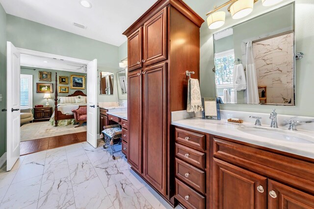 bathroom with vanity and hardwood / wood-style flooring