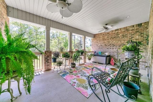 exterior space with ceiling fan