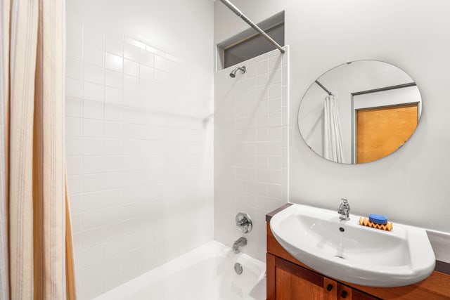 bathroom featuring vanity and shower / tub combo with curtain