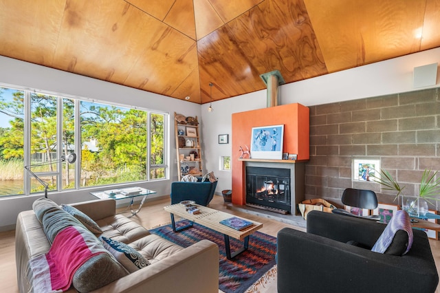 living room with wood ceiling, lofted ceiling, and light wood-type flooring