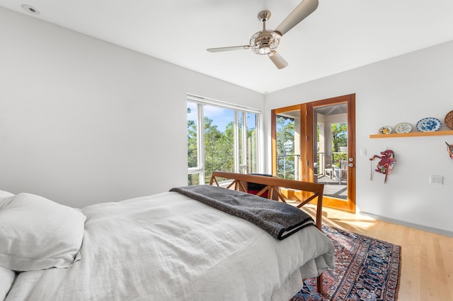 bedroom with ceiling fan, hardwood / wood-style flooring, and access to outside