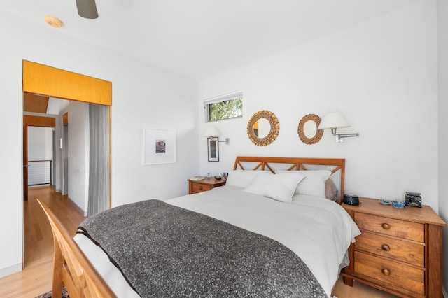 bedroom featuring ceiling fan and light hardwood / wood-style flooring