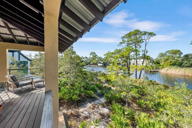 wooden deck featuring a water view