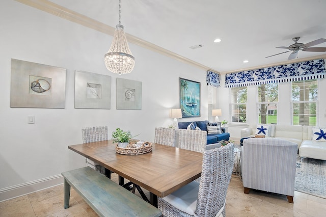 dining room with crown molding, ceiling fan with notable chandelier, and light tile patterned floors