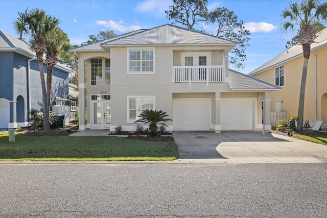 view of front facade featuring a balcony and a garage