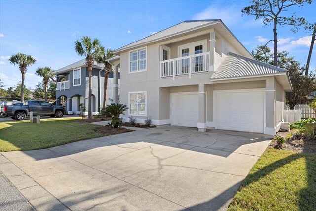 view of front facade with a front lawn, a garage, and a balcony