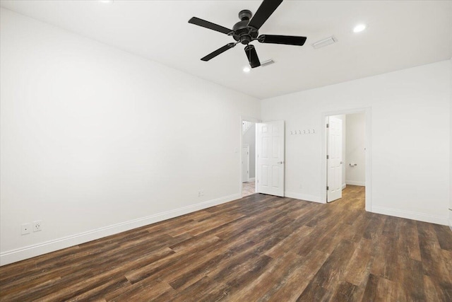 unfurnished bedroom with dark hardwood / wood-style flooring and ceiling fan