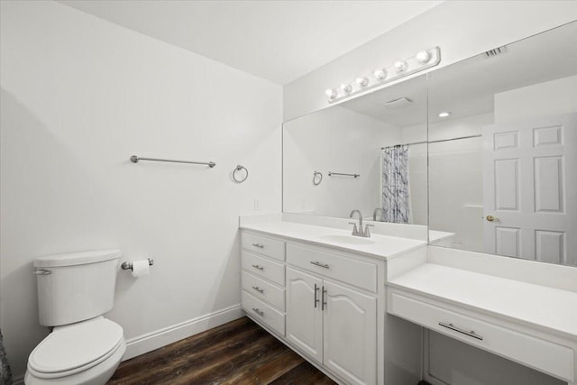 bathroom with vanity, toilet, wood-type flooring, and a shower with curtain