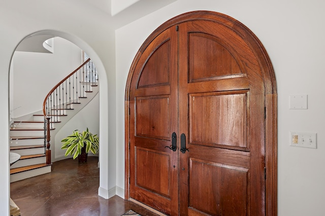 215 Rue St, Tropez, Miramar Beach, FL 32550 - entryway with baseboards, concrete flooring, and stairway