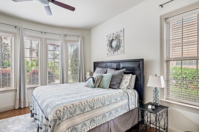 bedroom featuring dark hardwood / wood-style floors and ceiling fan