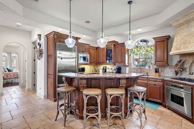 215 Rue St, Tropez, Miramar Beach, FL 32550 - kitchen featuring recessed lighting, stone tile floors, built in appliances, and light stone countertops