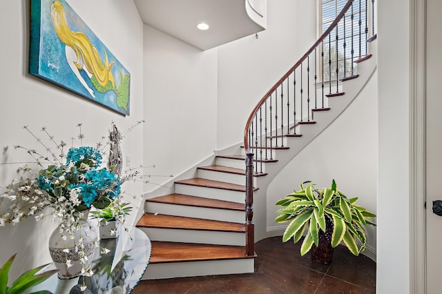 215 Rue St, Tropez, Miramar Beach, FL 32550 - stairs featuring recessed lighting, baseboards, concrete floors, and a high ceiling