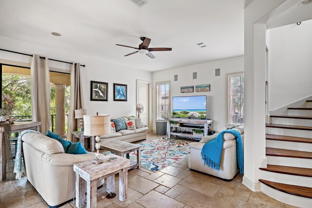 215 Rue St, Tropez, Miramar Beach, FL 32550 - living room with stairway, a ceiling fan, stone tile flooring, and a wealth of natural light