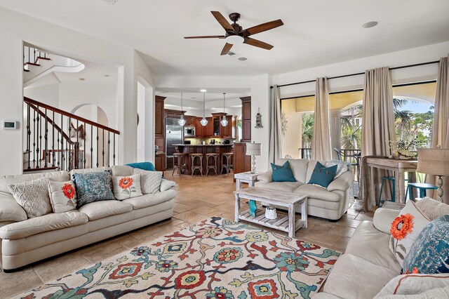215 Rue St, Tropez, Miramar Beach, FL 32550 - living room featuring stone tile floors, stairs, and a ceiling fan