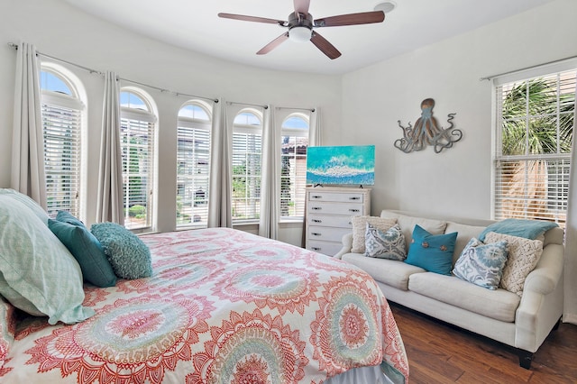 bedroom featuring ceiling fan and dark hardwood / wood-style floors